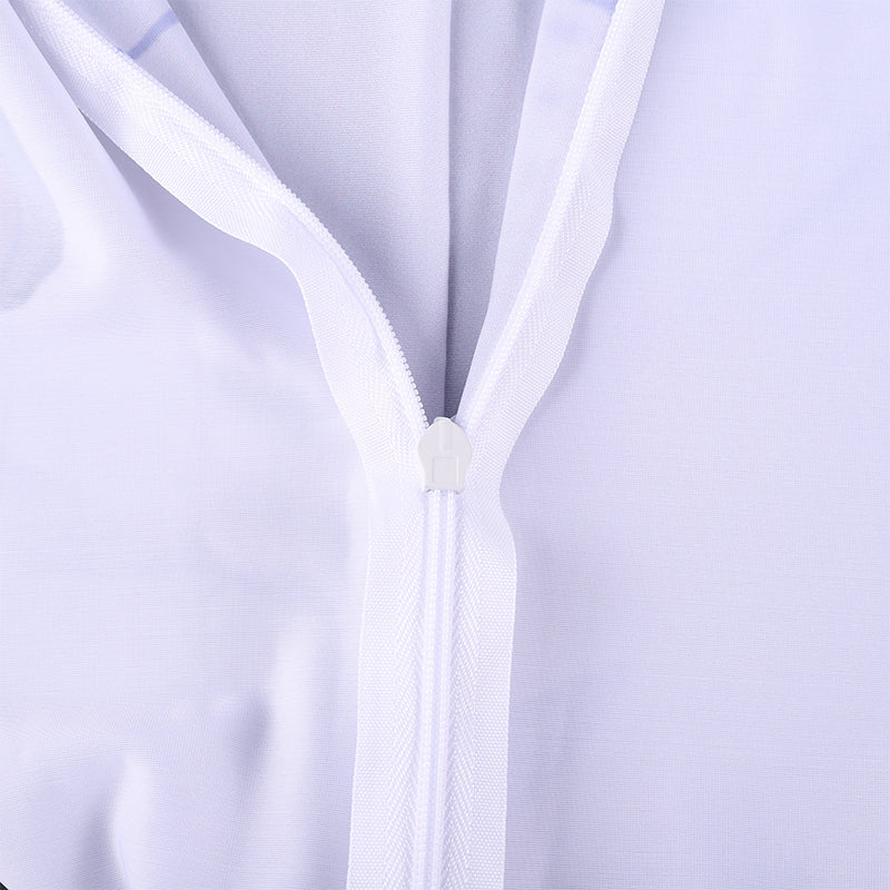 Close-up of a white zipper on a light purple background