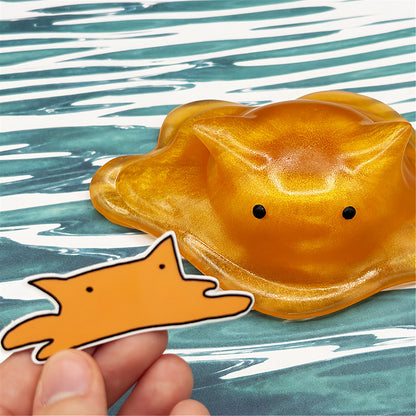 Cat-shaped resin blob on a striped background