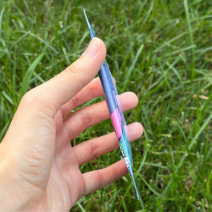 A hand holds a cartoon sticker next to a printed card pack titled "CopyCards Faithful Flock" on grass outdoors.