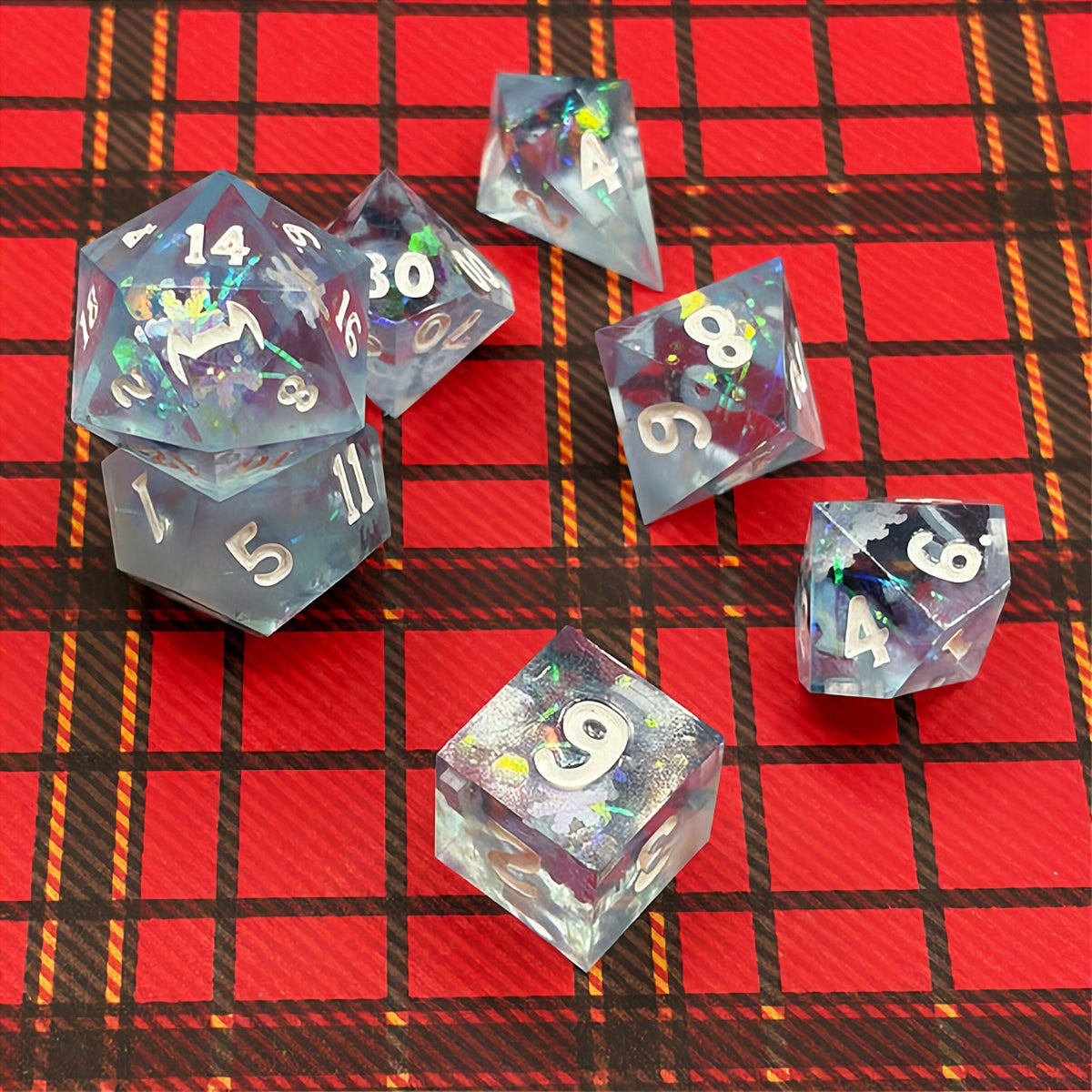 Set of icy blue dice with star patterns on a dark background