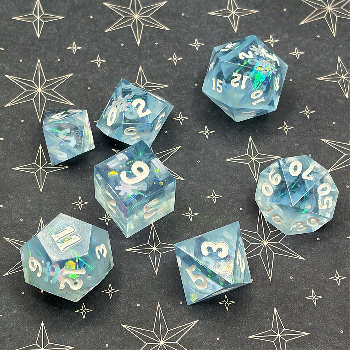 Set of icy blue dice with star patterns on a dark background