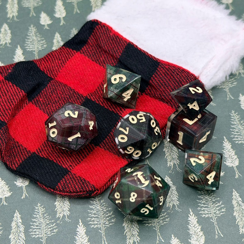 cozy dice set with a christmas stocking in plaid