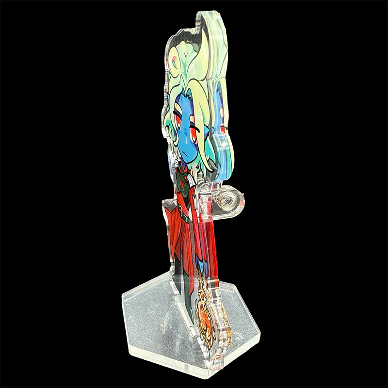 Colorful figurine on a transparent stand against a black background