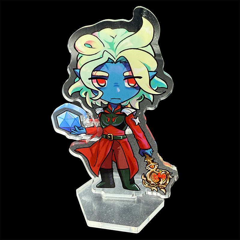 Colorful character figurine with a dice and staff on a reflective surface