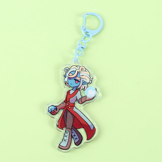 Colorful character keychain on a light green background