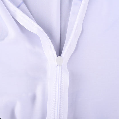 Close-up of a white zipper on a light purple background