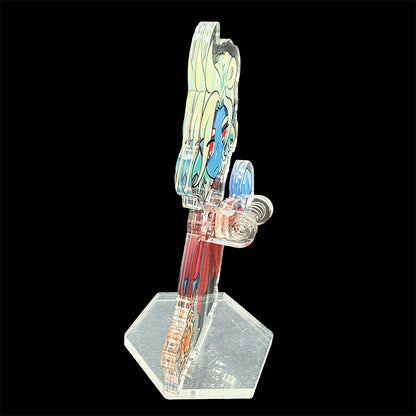 Colorful character on a clear stand against a black background